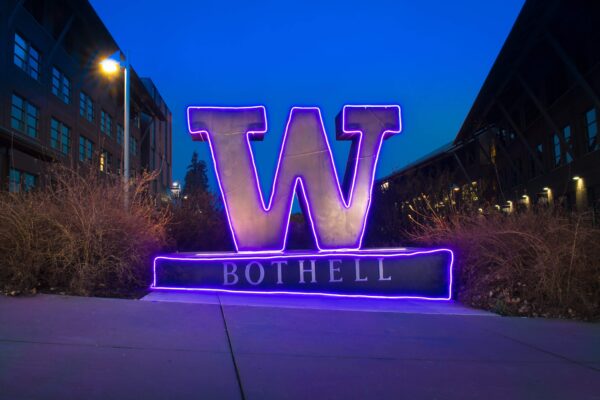 uwb w statue at night lit up purple