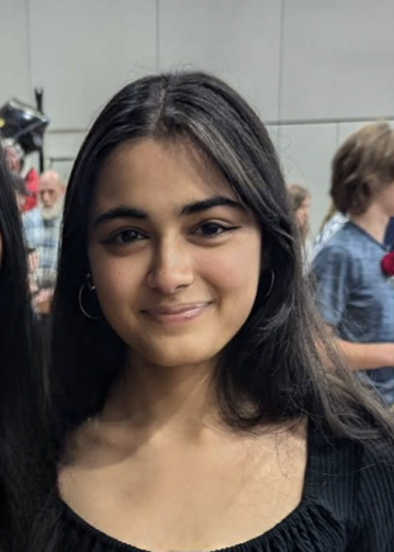 Image of Nandini Mistry with a background of students