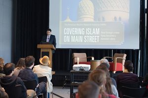 Karam Dana Presenting "Covering Islam on Main Street" in front of individuals