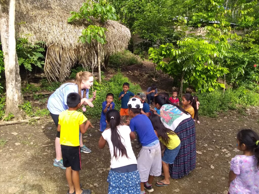 A person with a group of children.