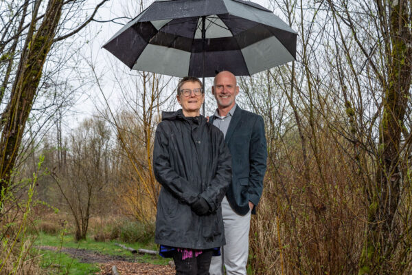 Two people under an umbrella.