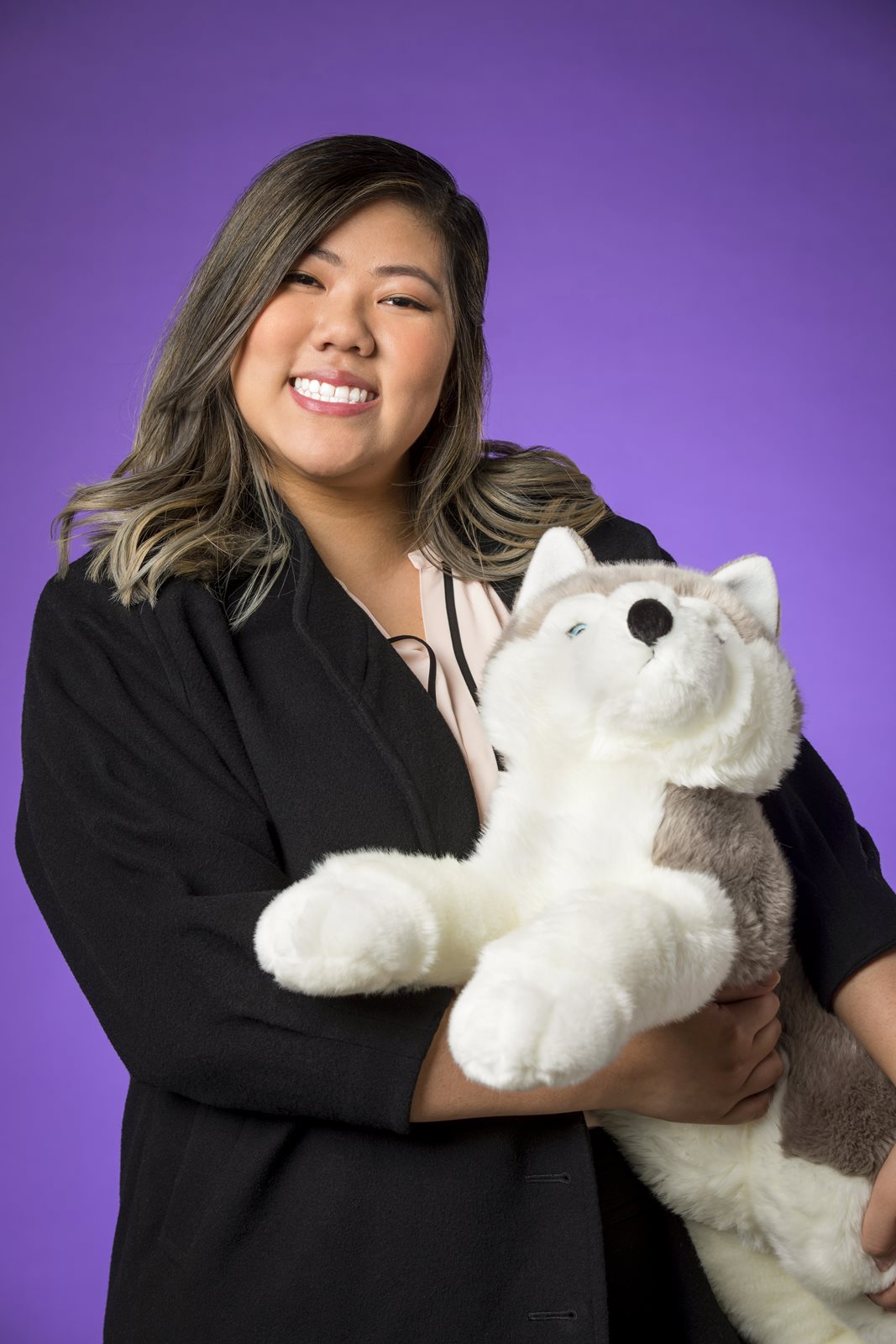 Jessica Nguyen holding a husky plush