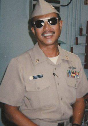 Sr. Chiefl Ronald G. Gamboa in US Navy uniform and sunglasses.