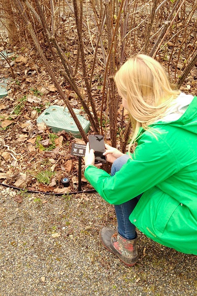 A student scanning a plant tag