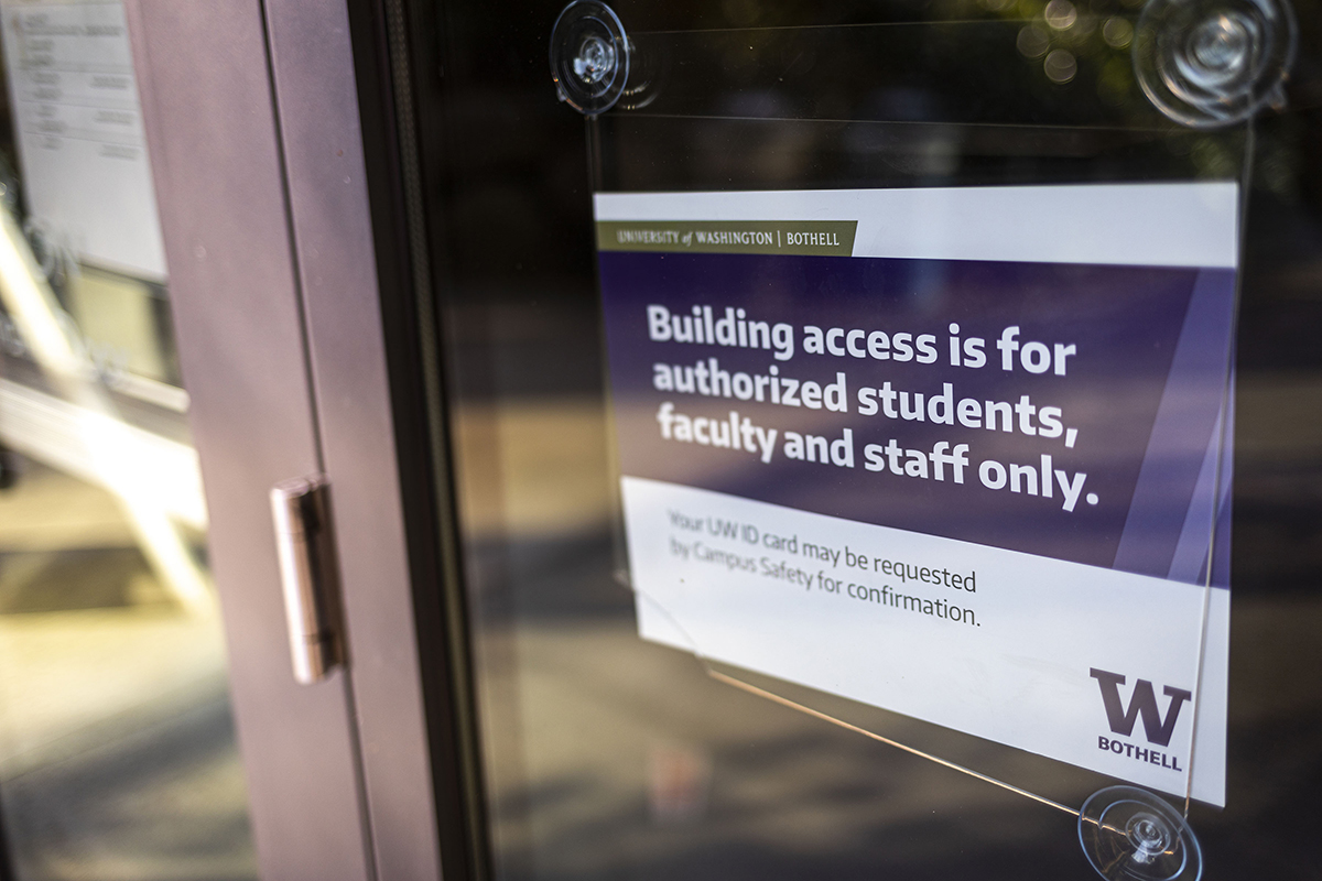 Photo of a door with signage restricting building access